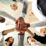 business people teamwork in an office with hands together