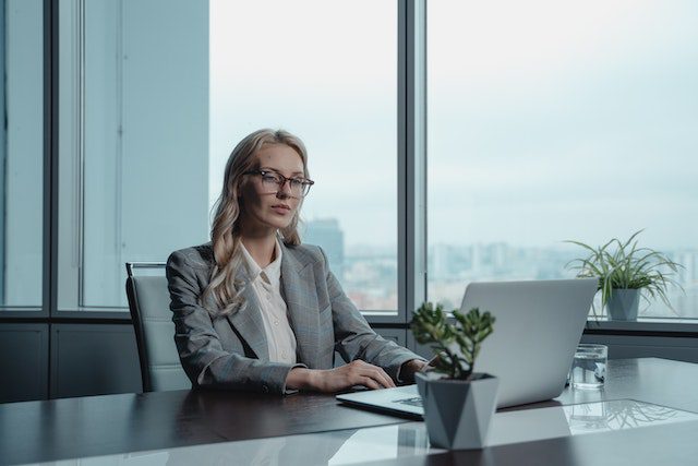 Woman at desk working on a laptop