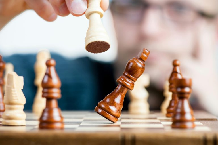 chess piece being knocked over